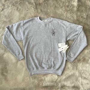 grey sweatshirt with a cute little peace sign